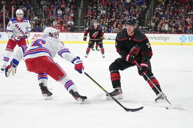 Slavin's quick strike leads Canes over Rangers in Game 1