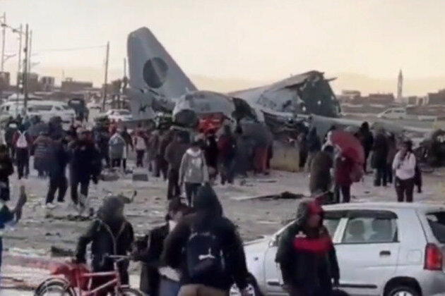 Military cargo plane loaded with cash crashes on highway 
