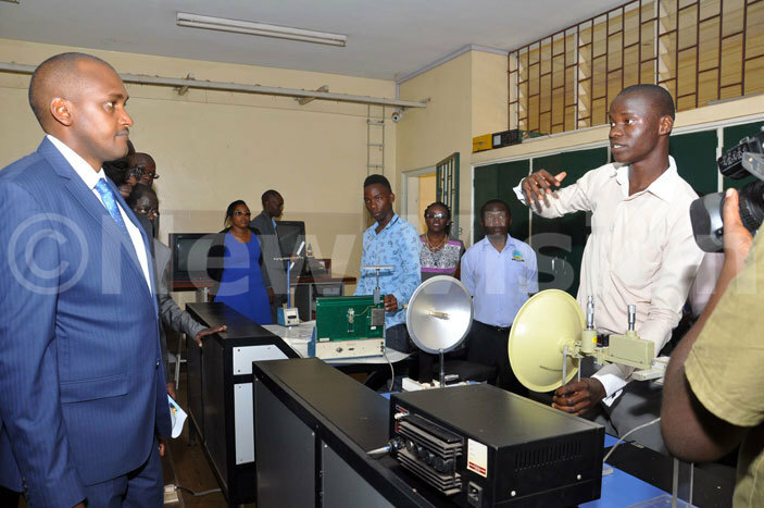  he  minister rank umwebaze left listens to students of ganda nstitute of nformation and ommunication echnology  during his visit to the institute on uesday ugust 30 2016 