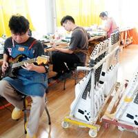 From farming to guitar manufacturing, east China town hits right notes