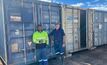 Rob Cream from Cream Mining (right) with Black Cat shift supervisor Lindon Carter (left,) next to some of the mobilised plant and equipment containers. Image supplied by Black Cat.