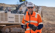 Bravus Mining and Resources CEO David Boshoff holding the first coal.