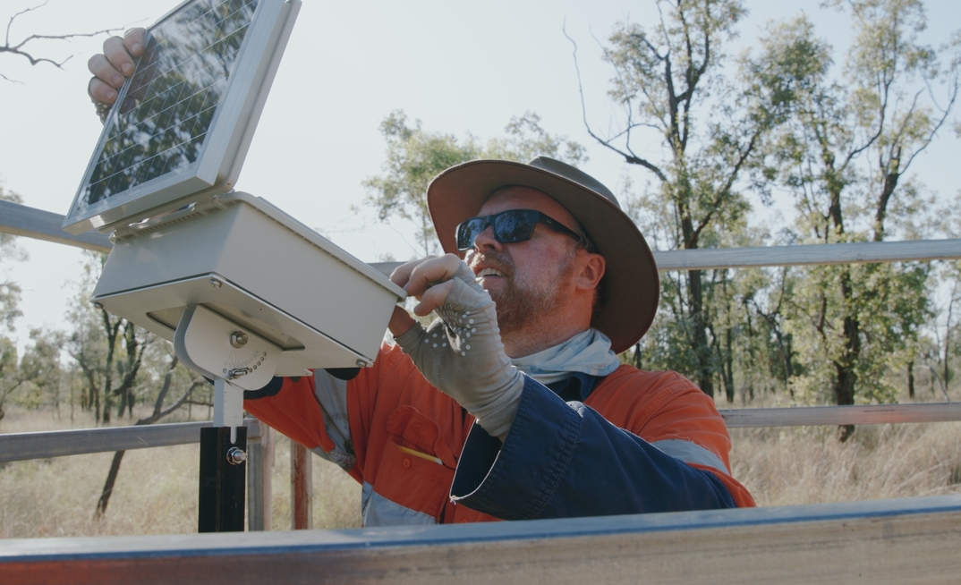 An E2M worker with one of the 27 radio towers covering about 2700 hectares of Black-throated Finch habitat.
