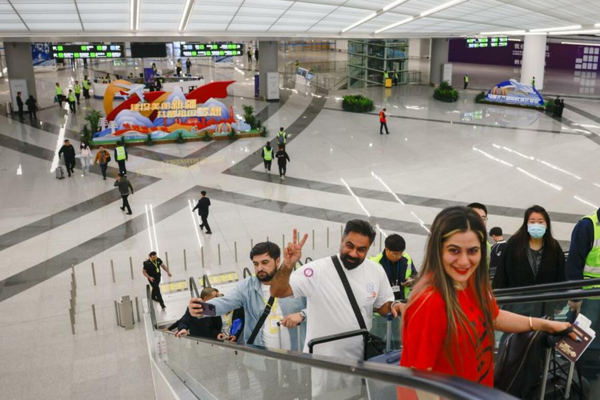 Xinjiang airport records soaring cross-border trips amid opening-up push