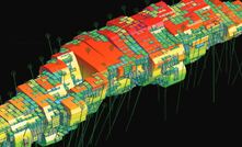 Wireframe orebody model in Geovia Surpac showing grade block model and drilling data