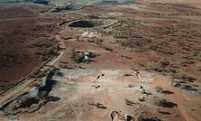  View looking north of drilling at Tumblegum South with Gabanintha open pits in background.