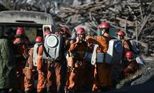 Rescuers enter the mine to start searching for the two missing miners