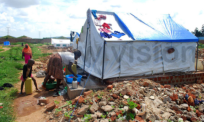  n arch this year this resident of usanja whose home was demolished did laundry in front of a makeshift tent her family shared with another family redit awrence ulondo