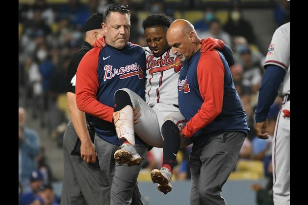 Braves' Ozzie Albies fouls ball off knee, leaves game