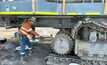  The worker was using a sledgehammer to remove the excavator drive sprocket.