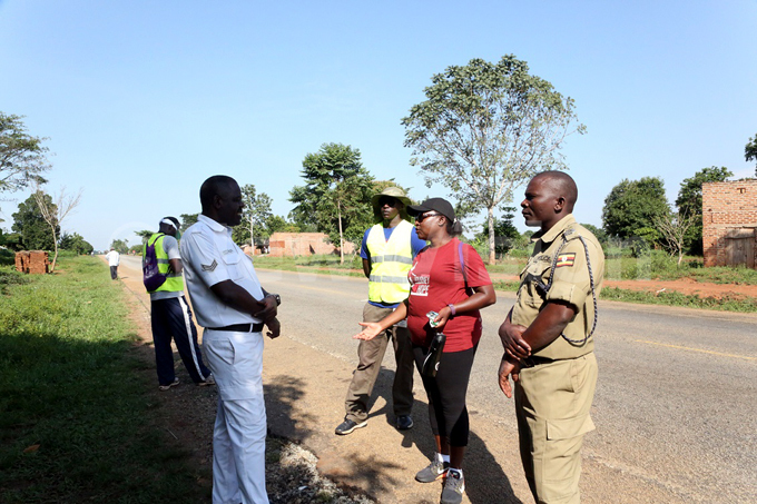 ita kemba speaks to a traffic officer in usembatia