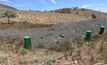 Razorback's muck pile with barrels ready to collect samples.