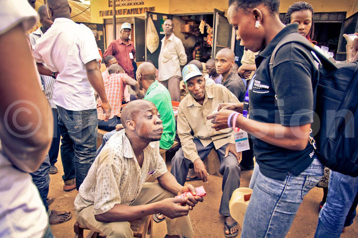   peer educator demostrats how to use a condom 