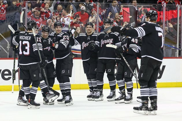 NHL roundup: Devils blow lead, top Canucks in OT