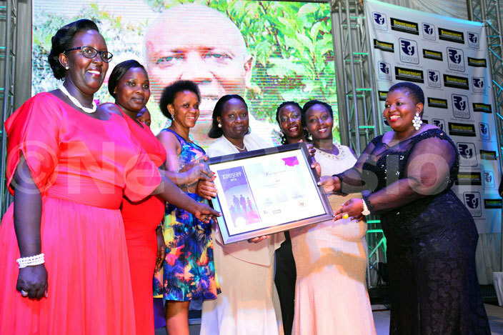 he  eam receives an award at the womens day banquet at serena kamapala hotel on march 03 2016 hoto by iriam amutebi