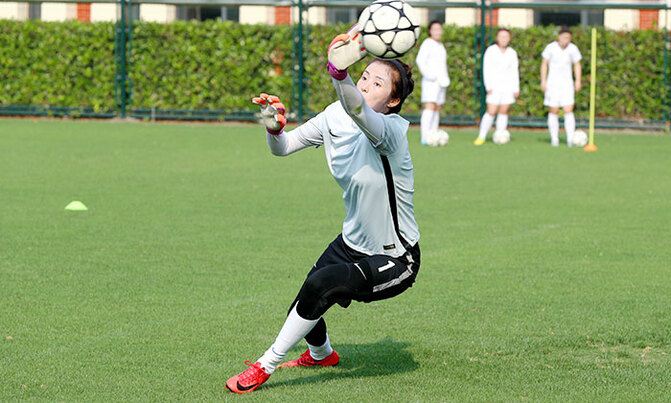 She's gloving it: China goalkeeper rejected catwalk for football She's gloving it: China goalkeeper rejected catwalk for football