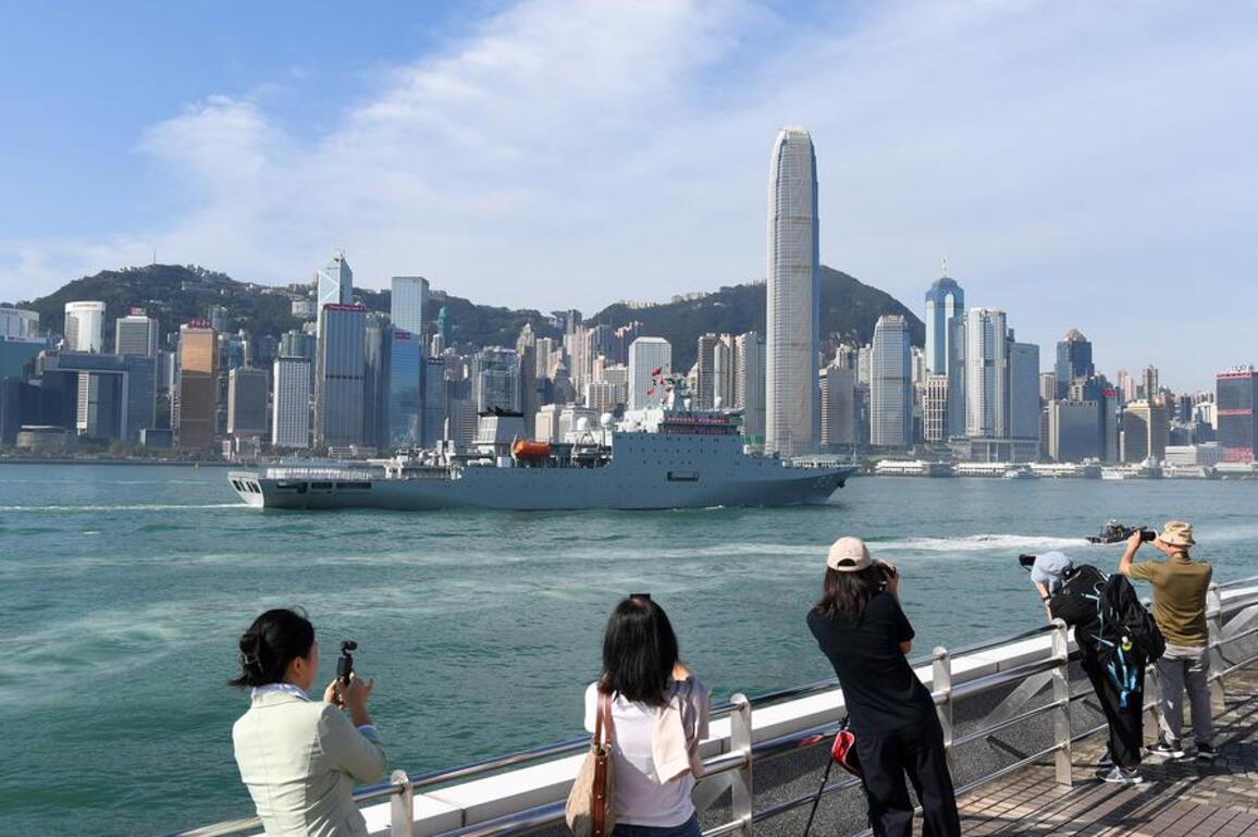 Standing on deck, feeling proud: Hong Kong residents tour PLA ships