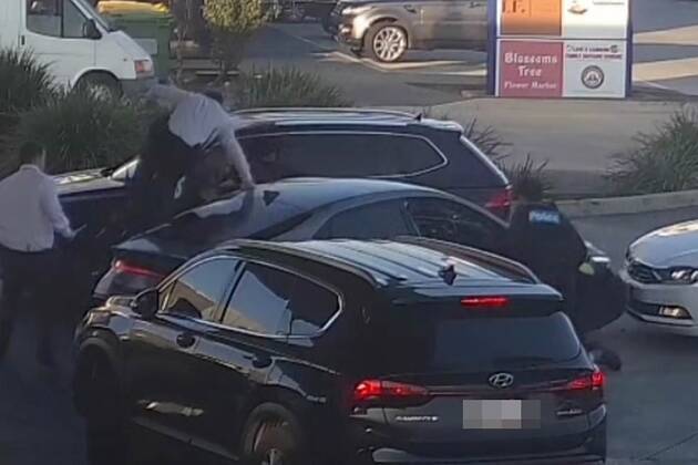 Wild scenes unfold at a Melbourne petrol station as THREE unmarked police cars swoop in on a driver