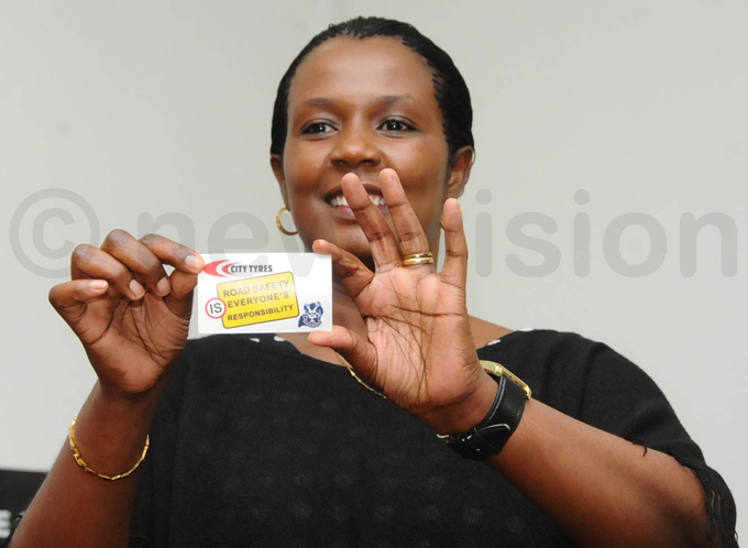 babazi displays stickers for the campaign hoto by palanyi sentongo