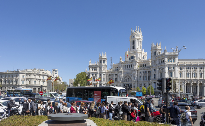 Large crowds fill the streets around Cibeles Square in Madrid during the nationwide blackout - Credit: iStock