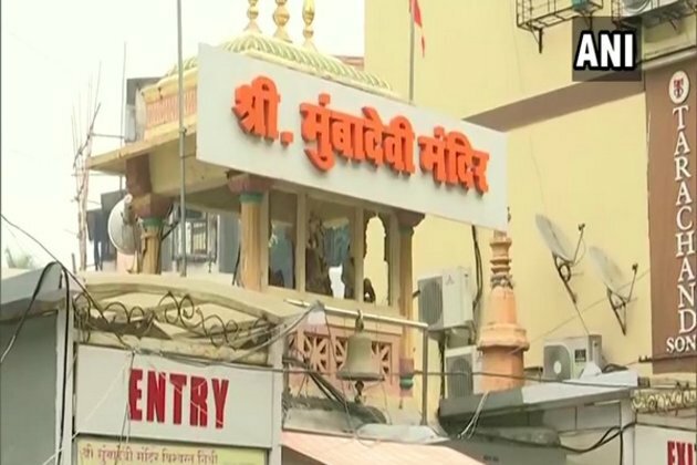 Devotees pray outside Mumba Devi temple amid pandemic restrictions