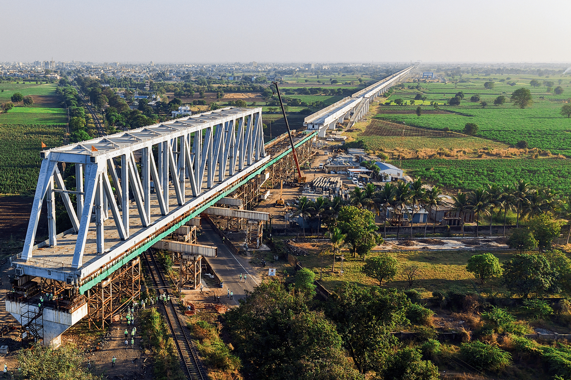 130 m span of a 230 m long steel bridge launched over NH-64 & Indian Railway tracks for Bullet Train Project