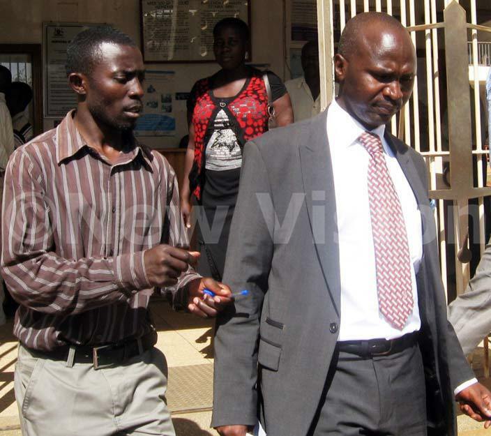 wemiyaga  heodore sekikubo leaves court where his opponet atrick kalubo is demanding a vote recount