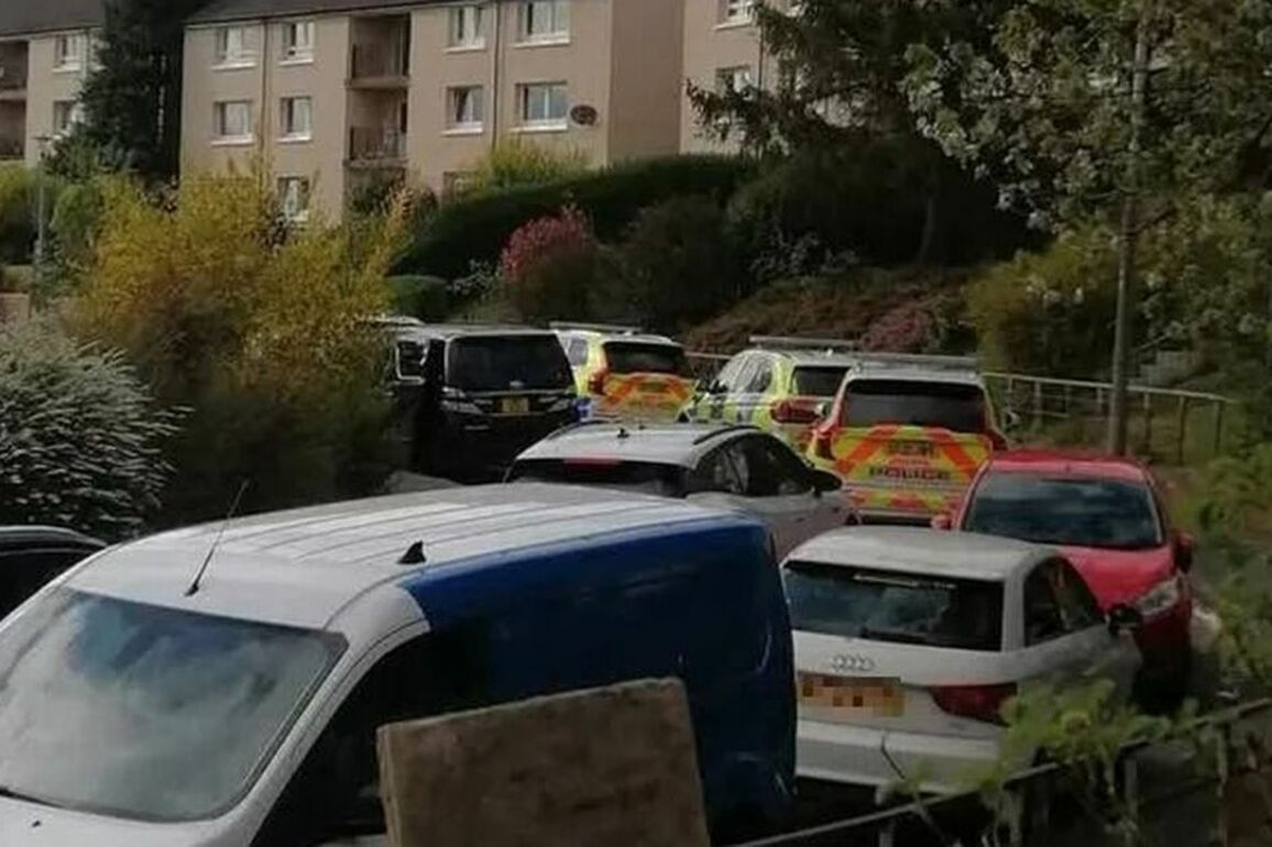 Armed cops lock down Edinburgh street and raid property in connection with gang feud