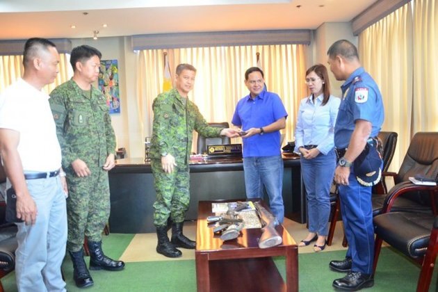 Former NPA rebels yield firearms, get gov't aid