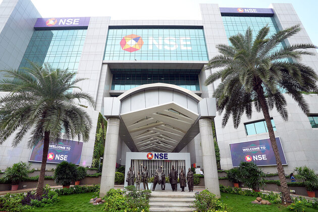 Indian markets open flat amid cautious global cues; Sensex, Nifty trade marginally lower