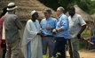 Sarama exploration manager Guy Scherrer (left centre) and CEO Andrew Dinning (centre right) speak with local villagers