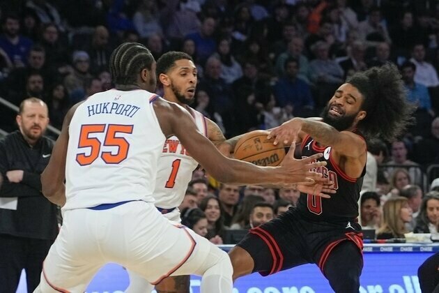 Short-handed Knicks need overtime to dodge Bulls