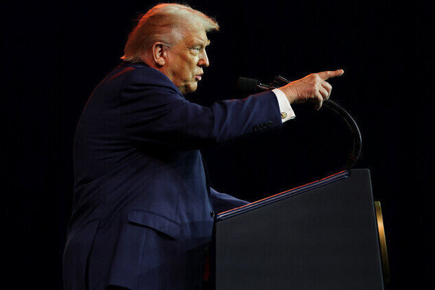 Trump warns he may go hard way on Greenland