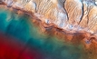 Titanium mine with tailing ponds filled with fluids used in ore enrichment. Photo: Mykhailo Pavlenko / Shutterstock