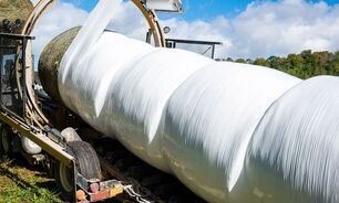 A farm operator has been charged after a worker was killed while operating a bale wrapper.