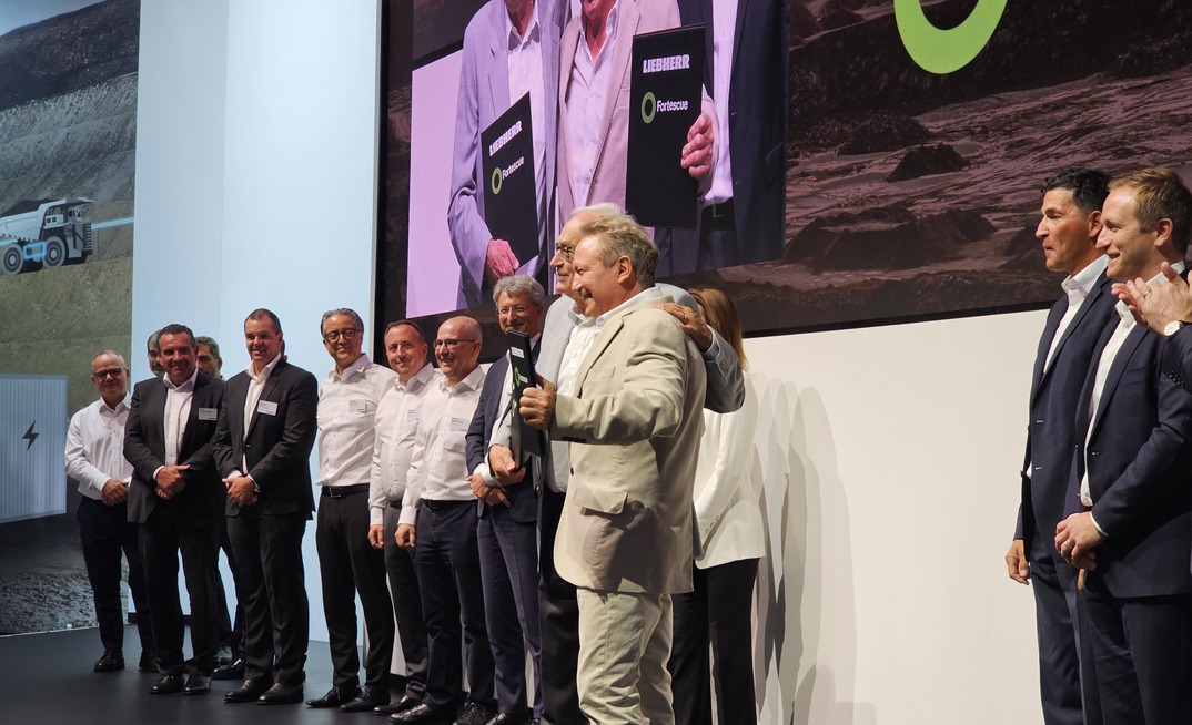 Andrew Forrest and Willi Liebherr celebrate their new chapter. Fortescue CEO Dino Obranto is on the right. Photo: Beth McLoughlin