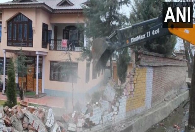 J-K: Boundary wall of Hizbul Mujahideen terrorist chief Amir Khan's house in Pahalgam razed