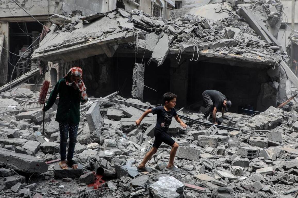 Defiant in Gaza's rubble, rescuers dig as danger, hunger close in