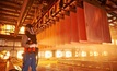 Happier times: A worker at BHP-operated Escondida mine in Chile Credit: BHP