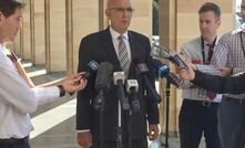 WA Attorney-General John Quigley talks to reporters outside WA's parliament.