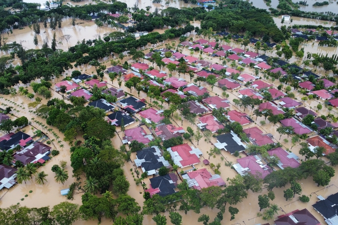Aceh Utara, Indonesia - 26 November 2025 : aerial view of the flooded PT Pupuk Iskandar Muda complex