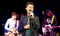 Covers rock sponsorship of Chichester charity show