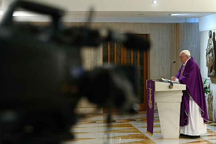  his photo taken and handout on arch 26 2020 by the atican edia shows a live broadcast television camera  as ope rancis celebrates a private morning mass at the anta arta chapel in he atican andout      