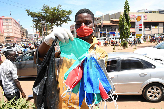   man selling masks on the streets  gandans are using protective gear to fight the virus hotos by ddie sejjoba