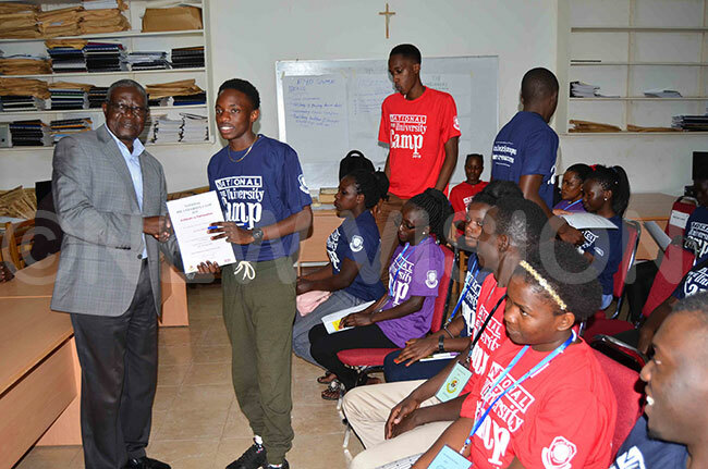  rof aviiri gives a certificate to one of the students who participated in the camp