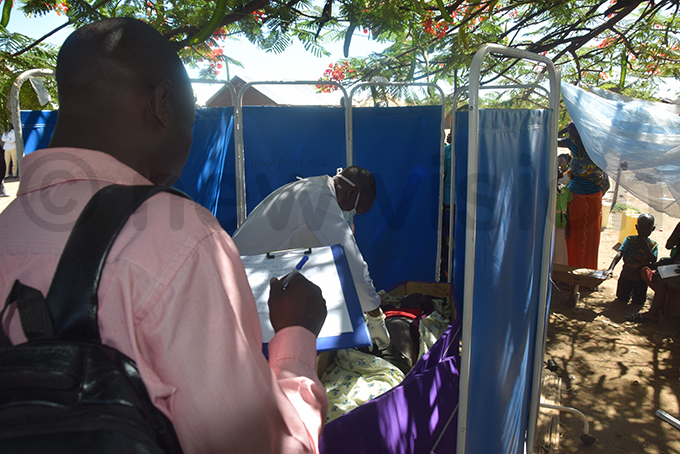 olice surgeon conducting a postmortem at ofo landing site in oima district hoto by smael asooha