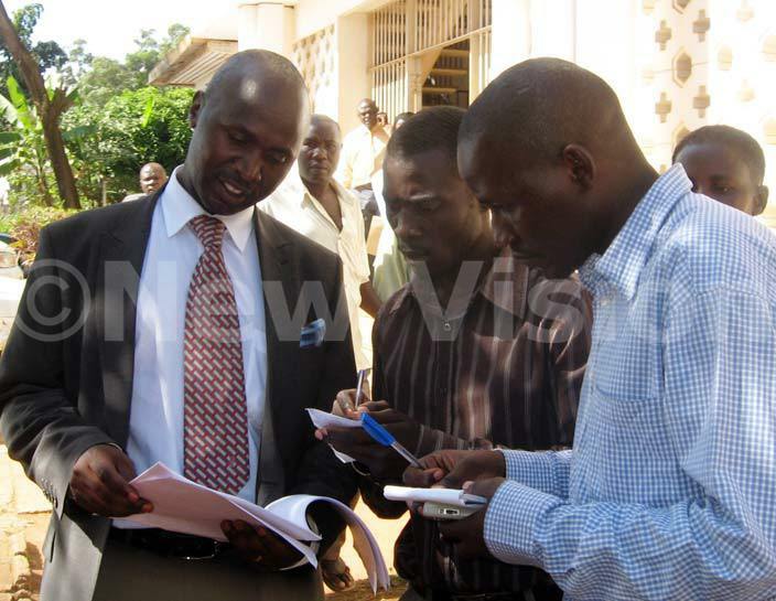  he wemiyaga  heodore sekikubo peruses the suit filed by kalubno outside court