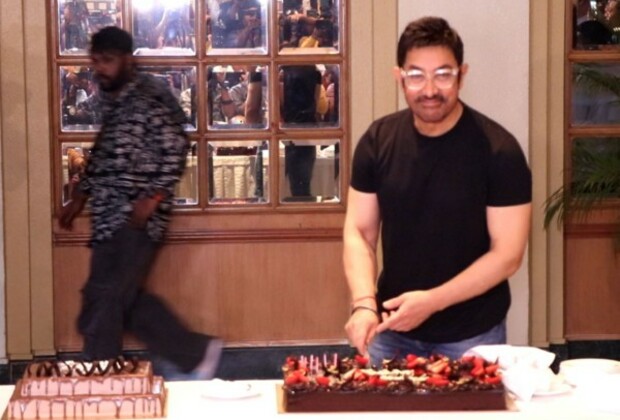 Aamir Khan celebrates 60th birthday with media, cuts cake