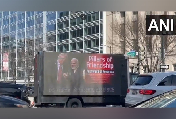 US: Mobile billboard advertising truck displays boards featuring pictures of PM Modi, Trump