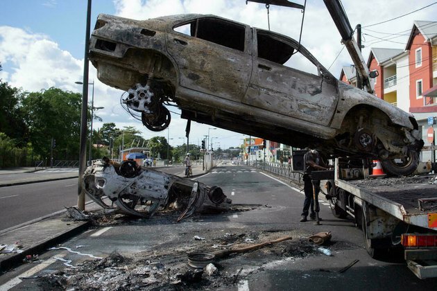 Fires break out as Covid-19 unrest spreads through French Caribbean